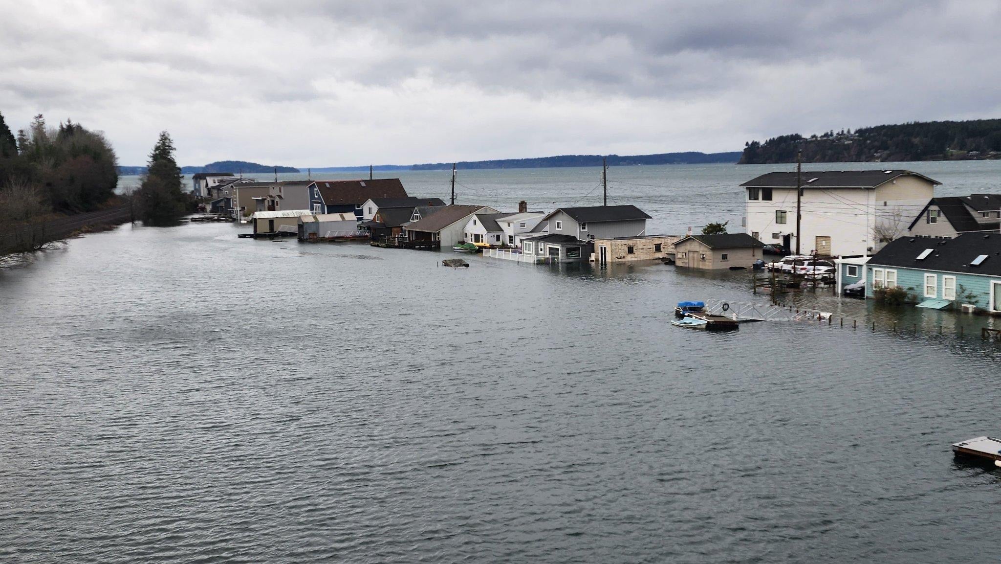 photo of homes on a flooded street on day island